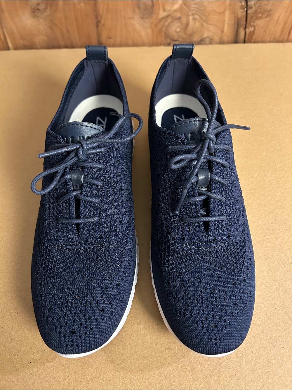 Women’s Cole Haan ZERØGRAND Stitchlite Wingtip Oxford Sneaker in marine blue.